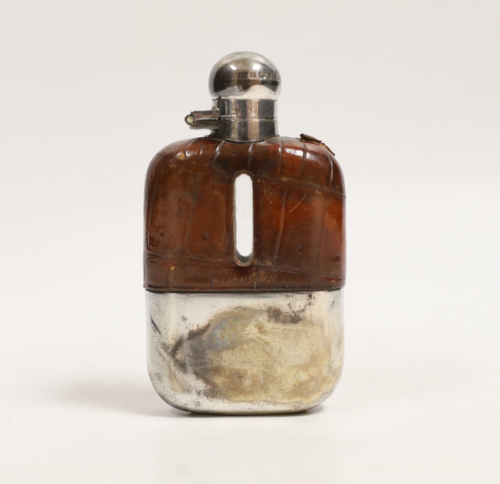 A small George V silver and crocodile skin mounted glass hip flask by James Dixon & Sons Ltd, Sheffield, 1911, 10.1cm.
